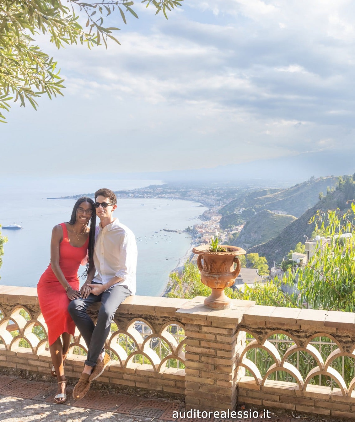 Couple walking in Taormina at golden hour